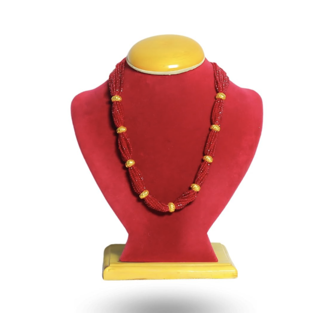 Embrace the heartbeat of Nepali tradition with our elegantly crafted Naugedi necklace. Synthesizing deep cultural heritage with modern grace, this sacred bridal piece features nine intricately fluted 24k gold beads woven into a luxurious cascade of vibran